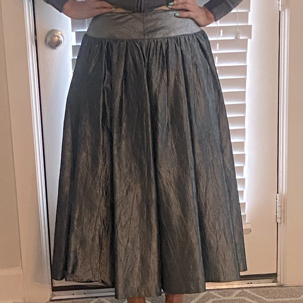 Full skirt. Silver color.
